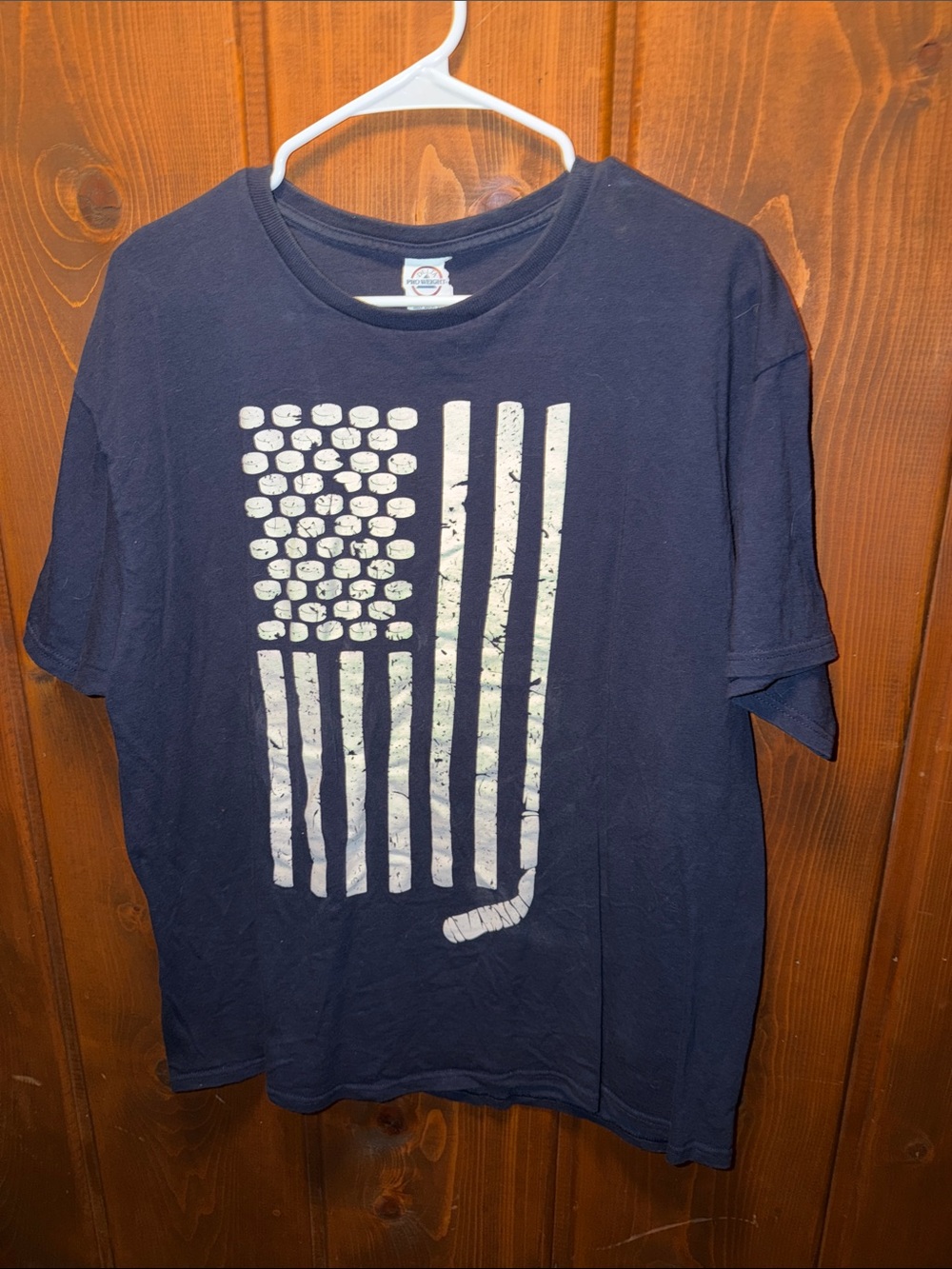 Delta Navy Blue Short Sleeve Tee with White Hockey Puck Flag Graphic